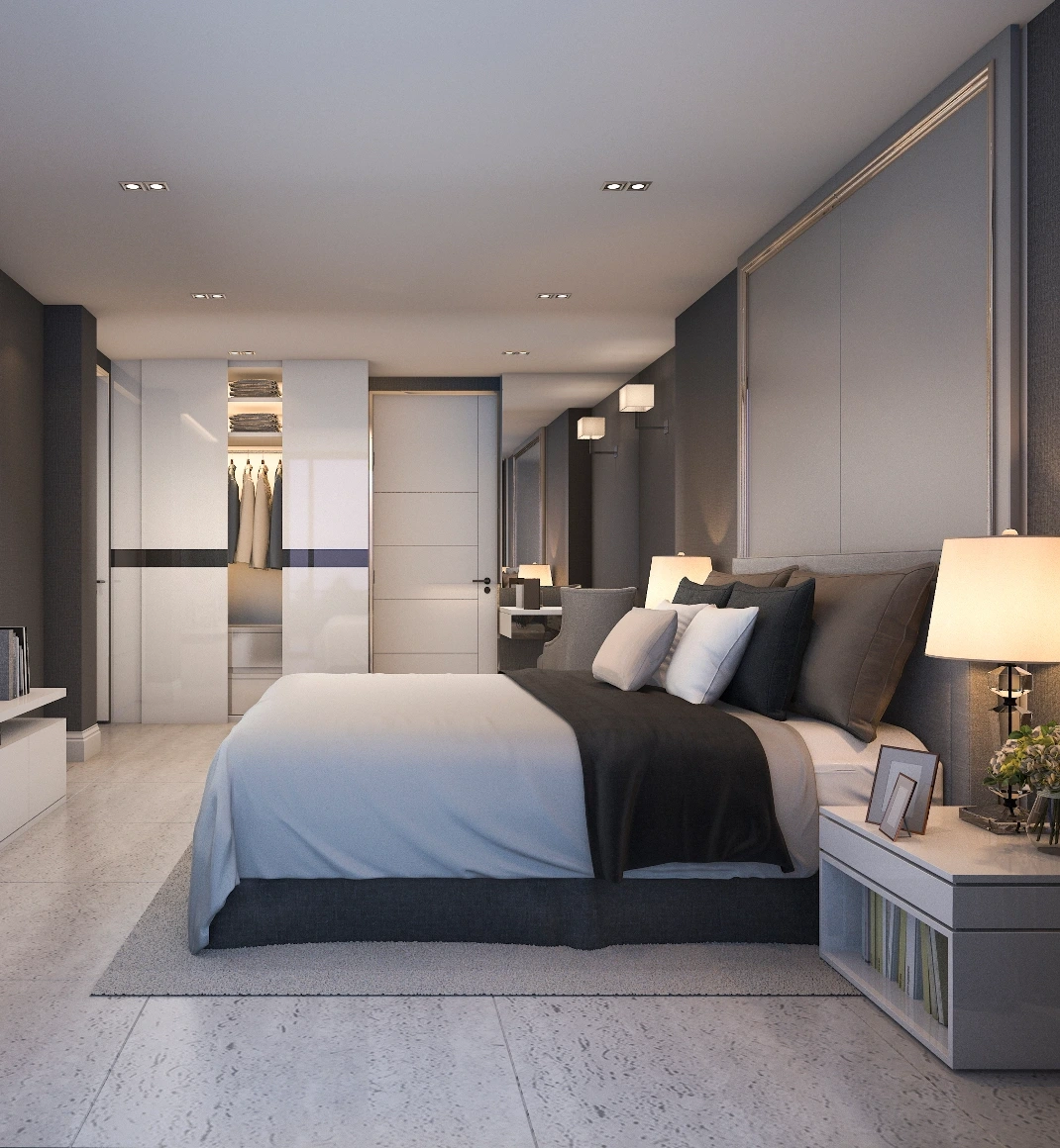 Ett minimalistiskt hotellsovrum med enkla linjer och dämpade färger i beige och svart. En säng med högkvalitativa sängkläder och mjuka kuddar är placerad i ena sidan av rummet. Hotellinredning Göteborg.